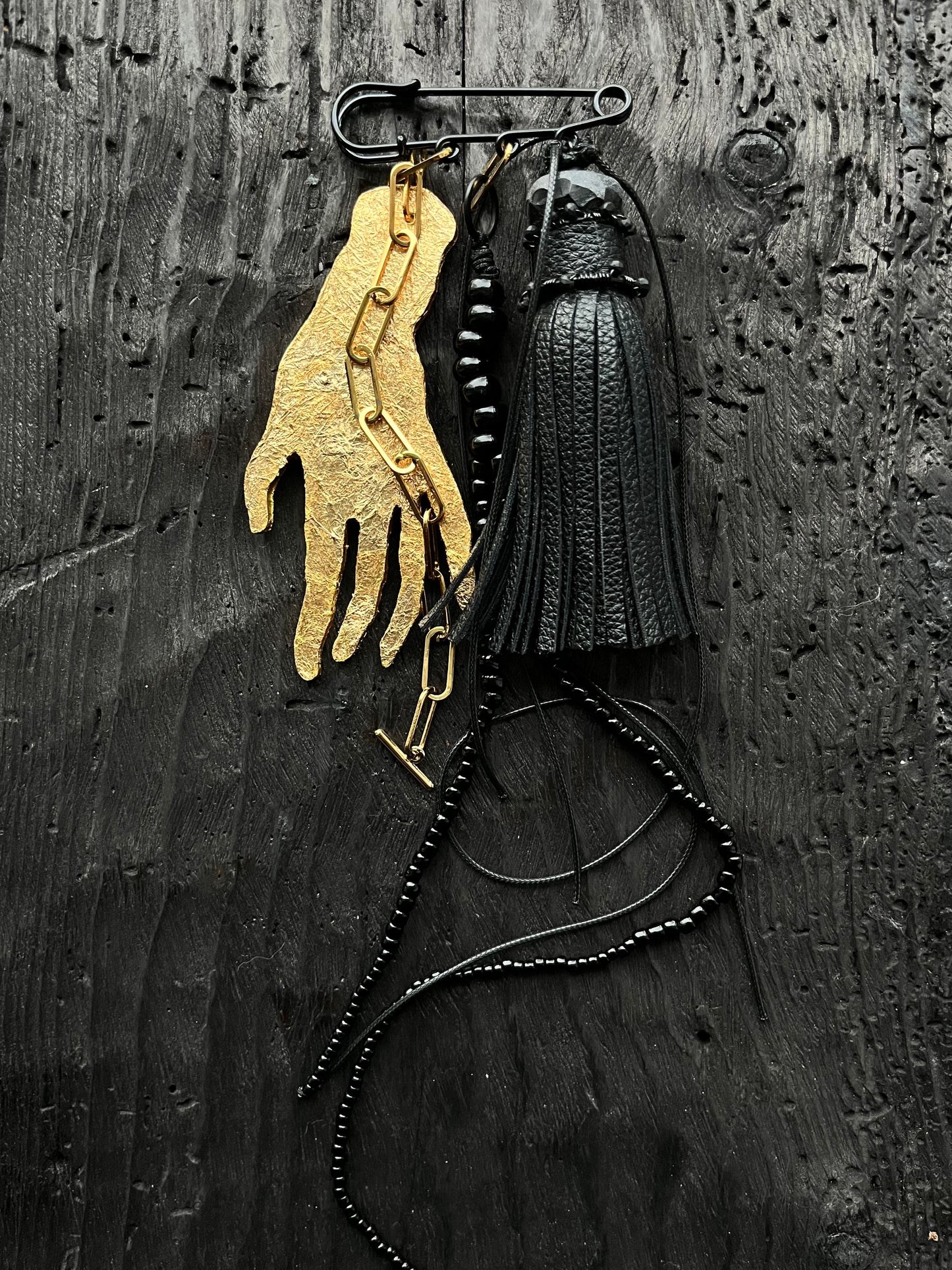 BROOCH WITH GOLDEN HAND PENDANT