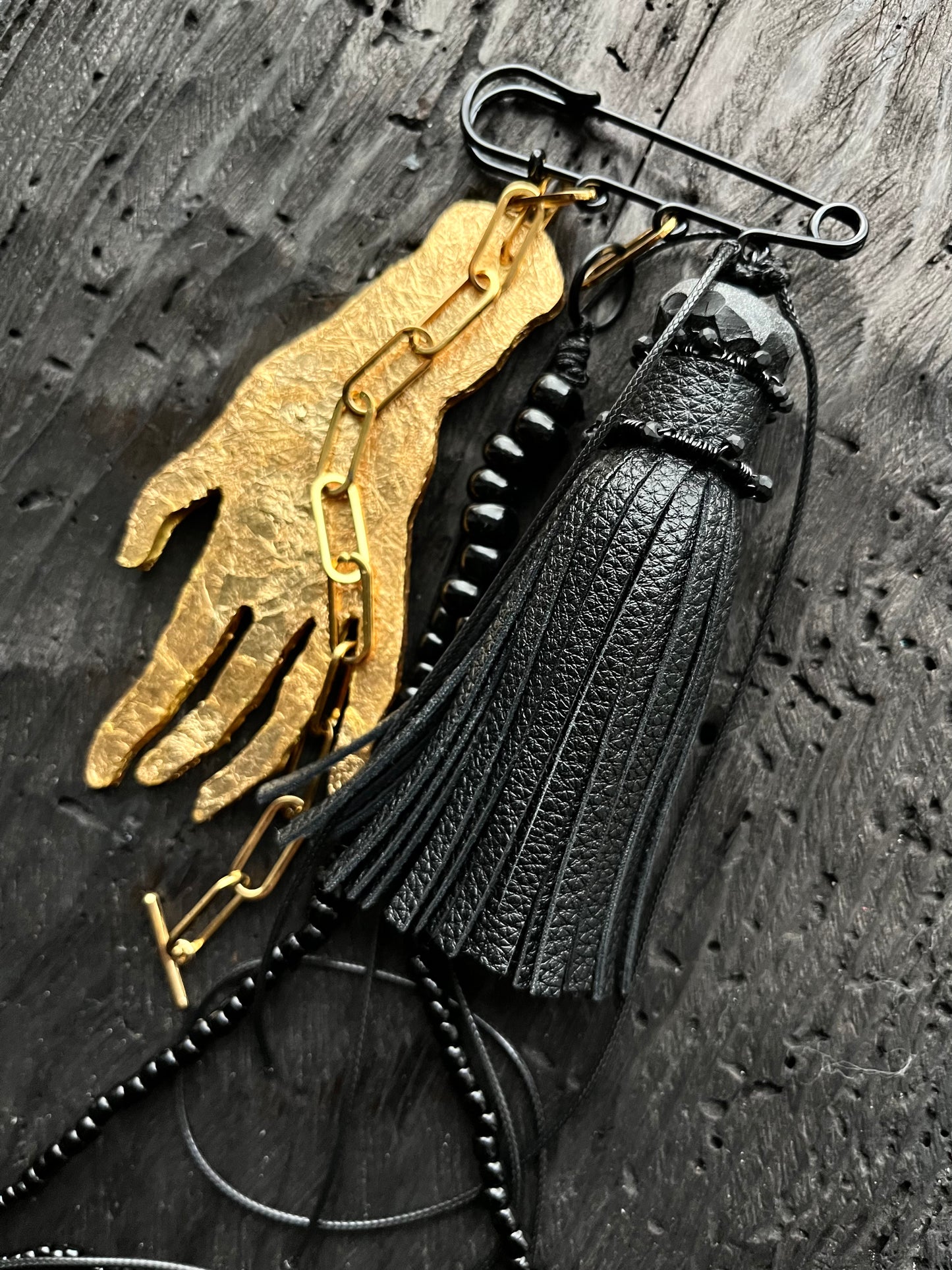 BROOCH WITH GOLDEN HAND PENDANT