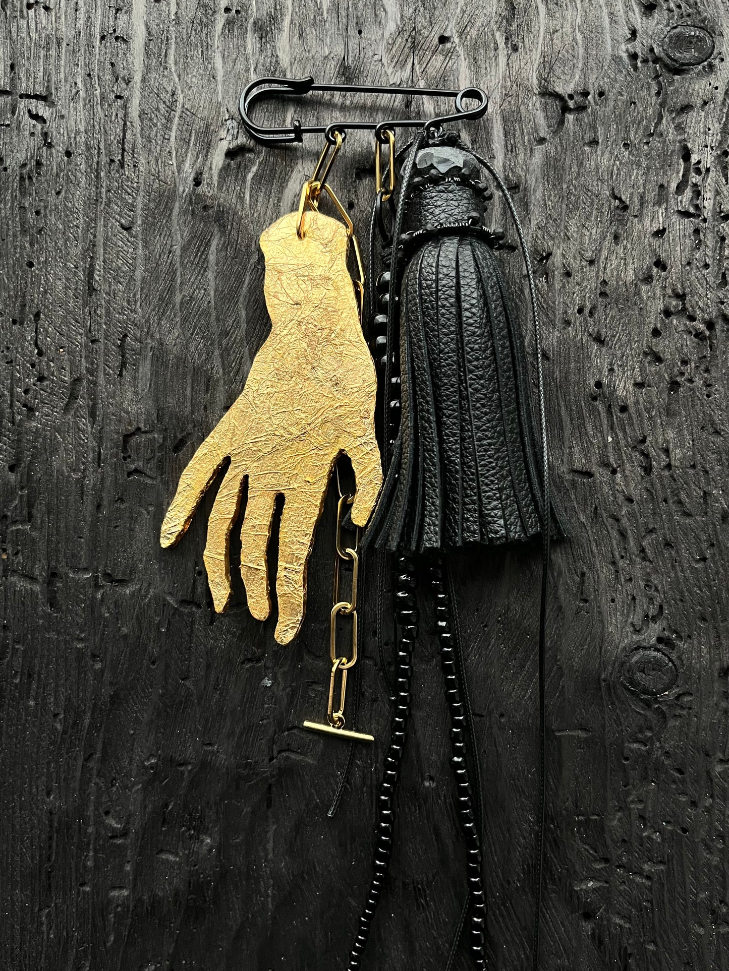 BROOCH WITH GOLDEN HAND PENDANT