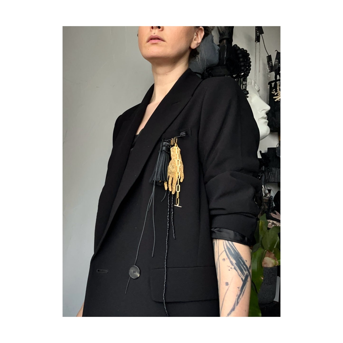 BROOCH WITH GOLDEN HAND PENDANT